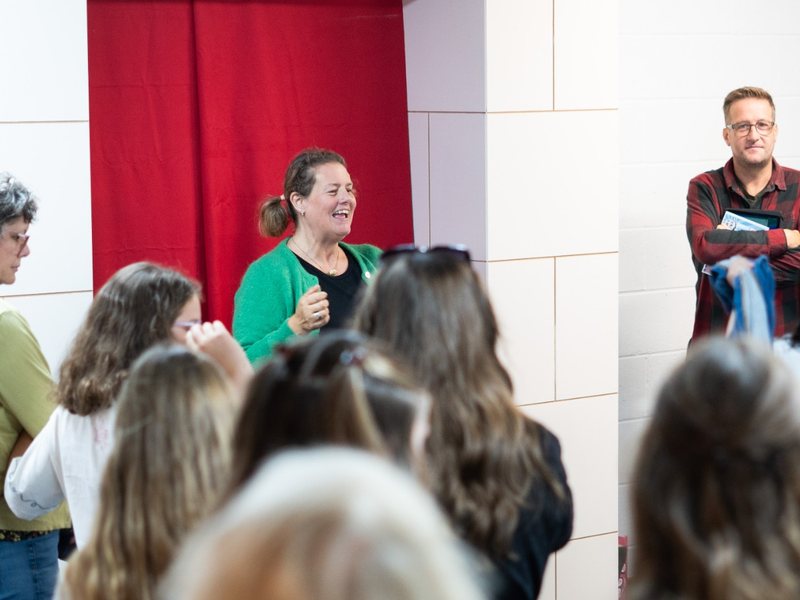 Sarah Sharpe speaking to a room of people